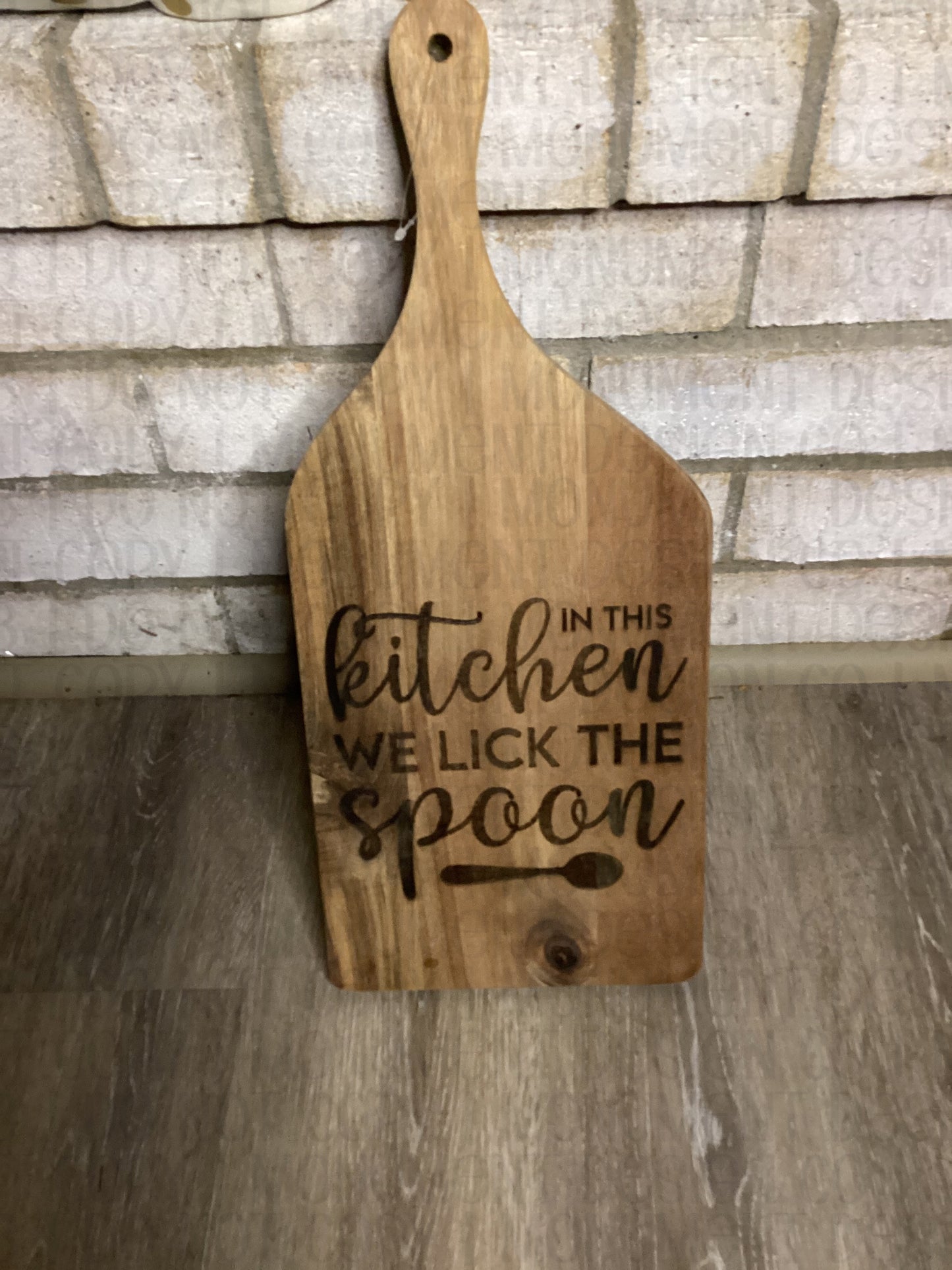 In This Kitchen We Lick The Spoon Cutting Board